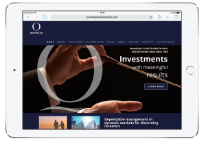 A tablet displays the Quotidian Investments website, enhanced by Glued, a branding agency in Warwickshire. The homepage features hands holding a pen against a dark background, showcasing services like Investments with meaningful results and Dependable management in dynamic markets.