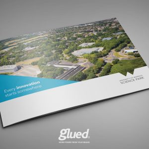 A brochure for the University of Warwick Science Park showcases an aerial view of the campus. The cover states, Every innovation starts somewhere, in a sleek blue and white design. Proudly at the bottom is the Glued Limited logo, a nod to their collaboration with a leading branding agency in Warwickshire.