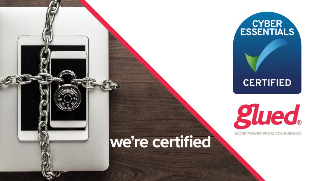 A laptop and smartphone secured with a chain and padlock are shown next to the words were certified. On the right, logos for Cyber Essentials Certified and Glued Limited showcase our commitment to security at Glued marketing, a leading branding agency in Warwickshire.